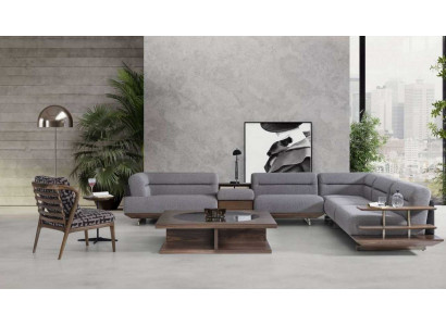 Ensemble de salon moderne avec canapé d'angle en L, fauteuil et table basse au design luxueux.